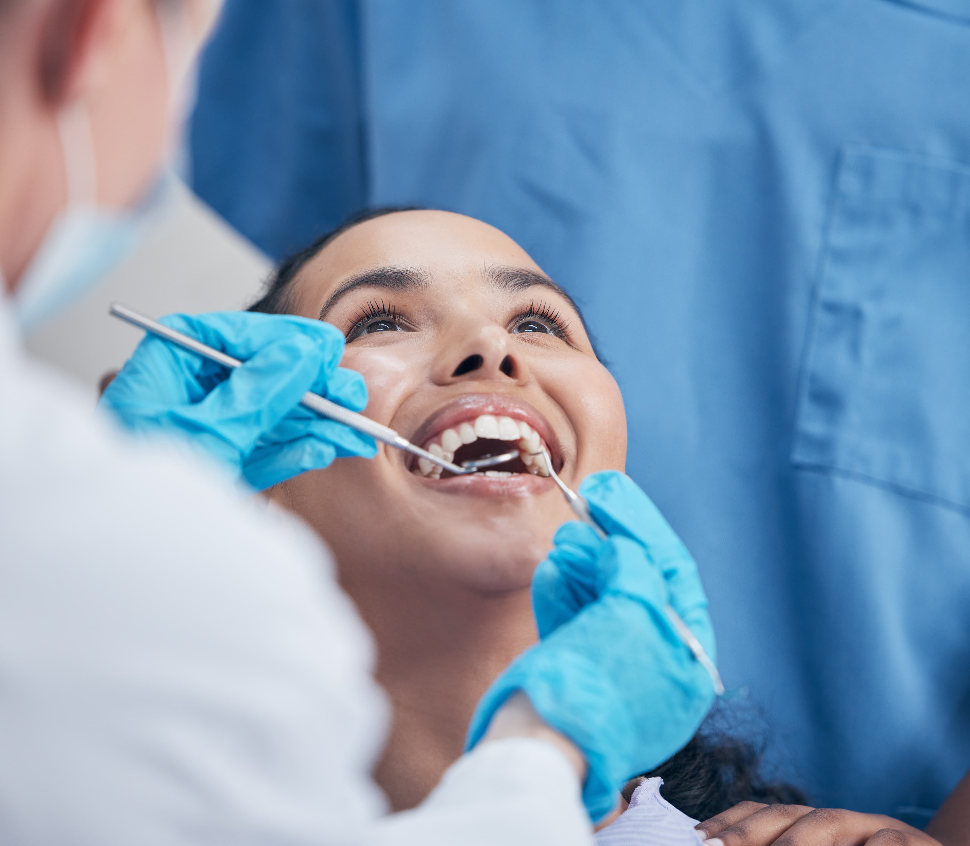 Dentist providing compassionate care to anxious patient